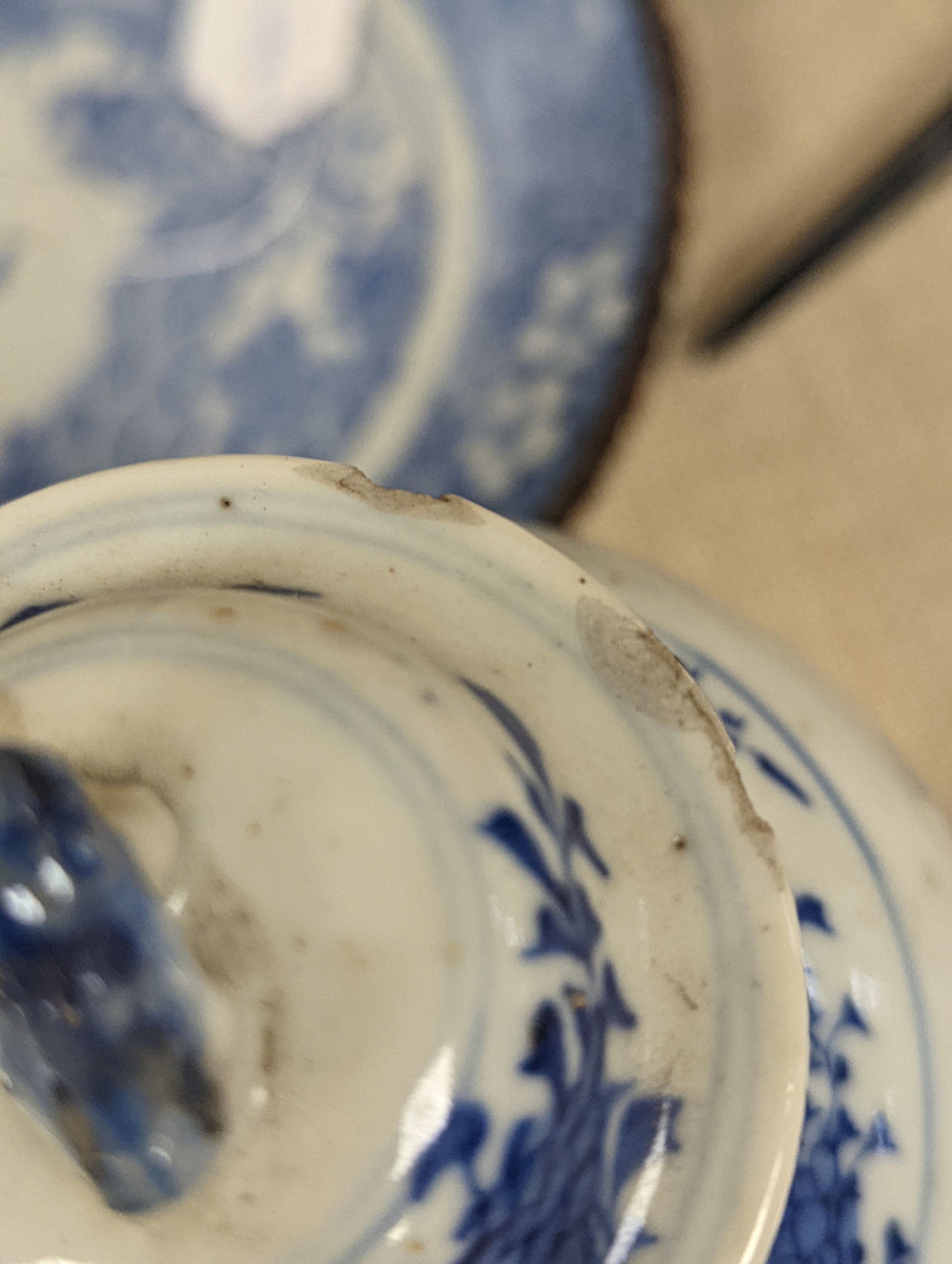 An early 20th century Chinese blue and white lidded vase together with a similar enamelled pottery vase and a Japanese blue and white dish. Tallest vase 29cm